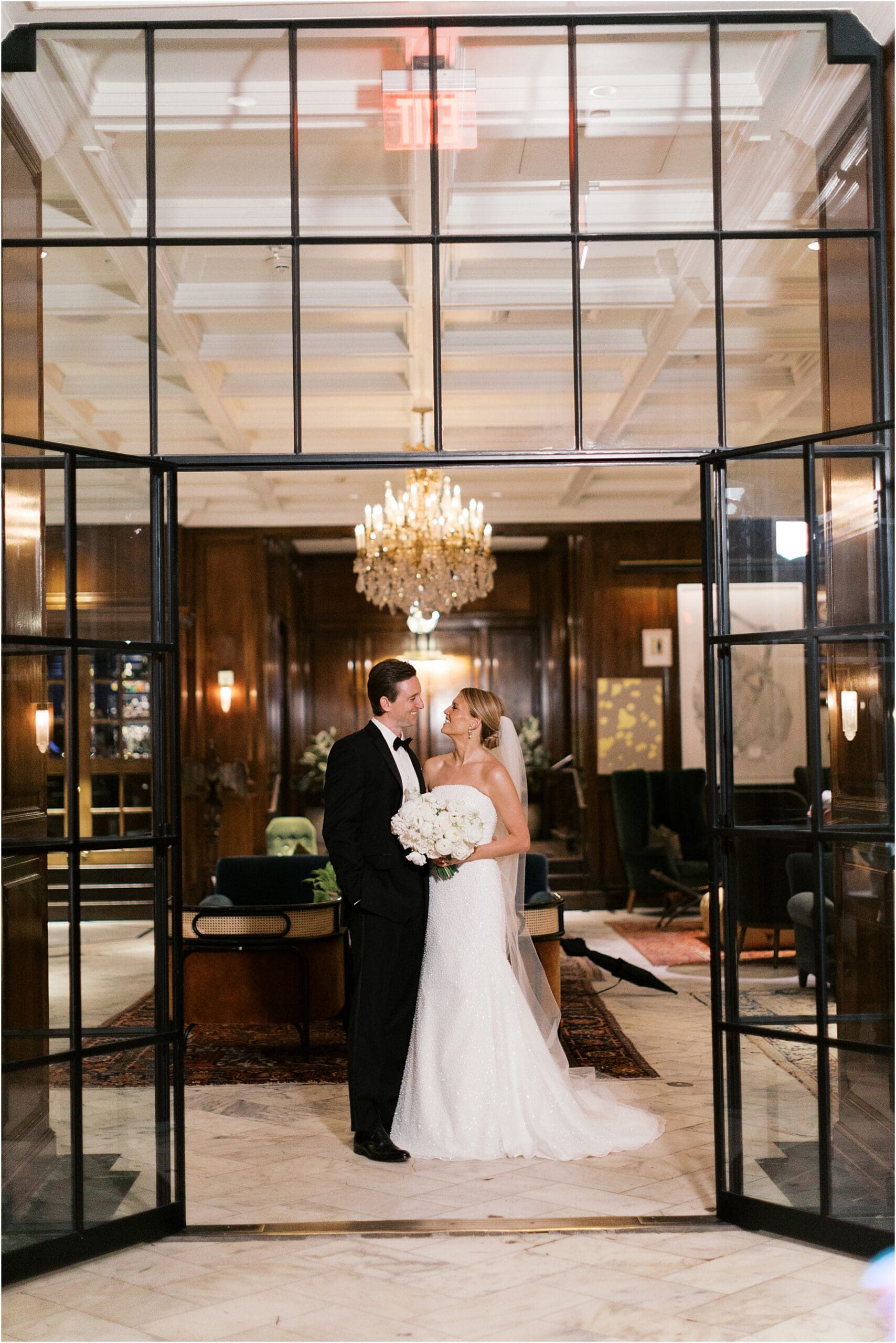 bride and groom in the lobby of the adolphus hotel in dallas texas