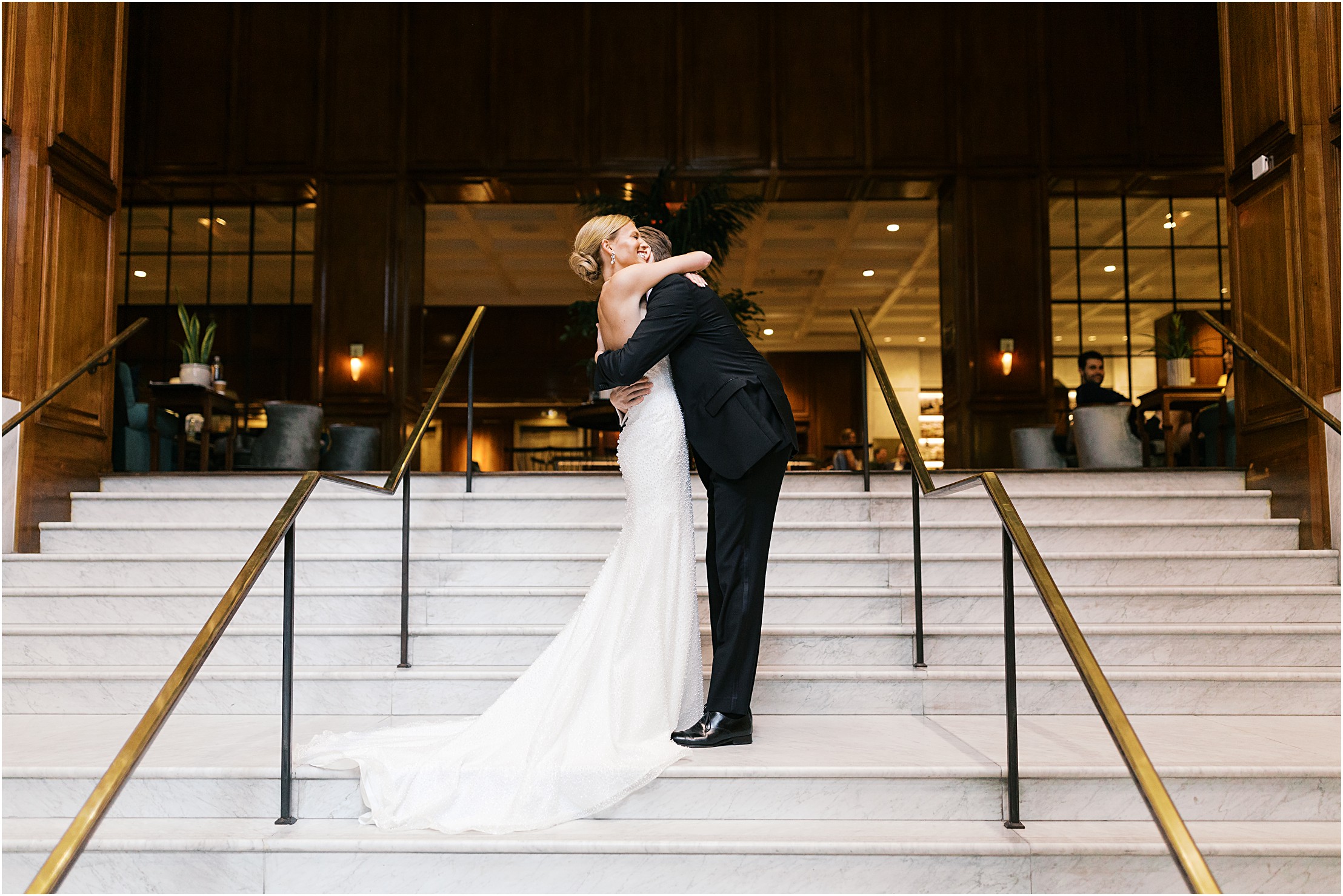 bride and groom first look at adolphus hotel on marble staircase in dallas texas