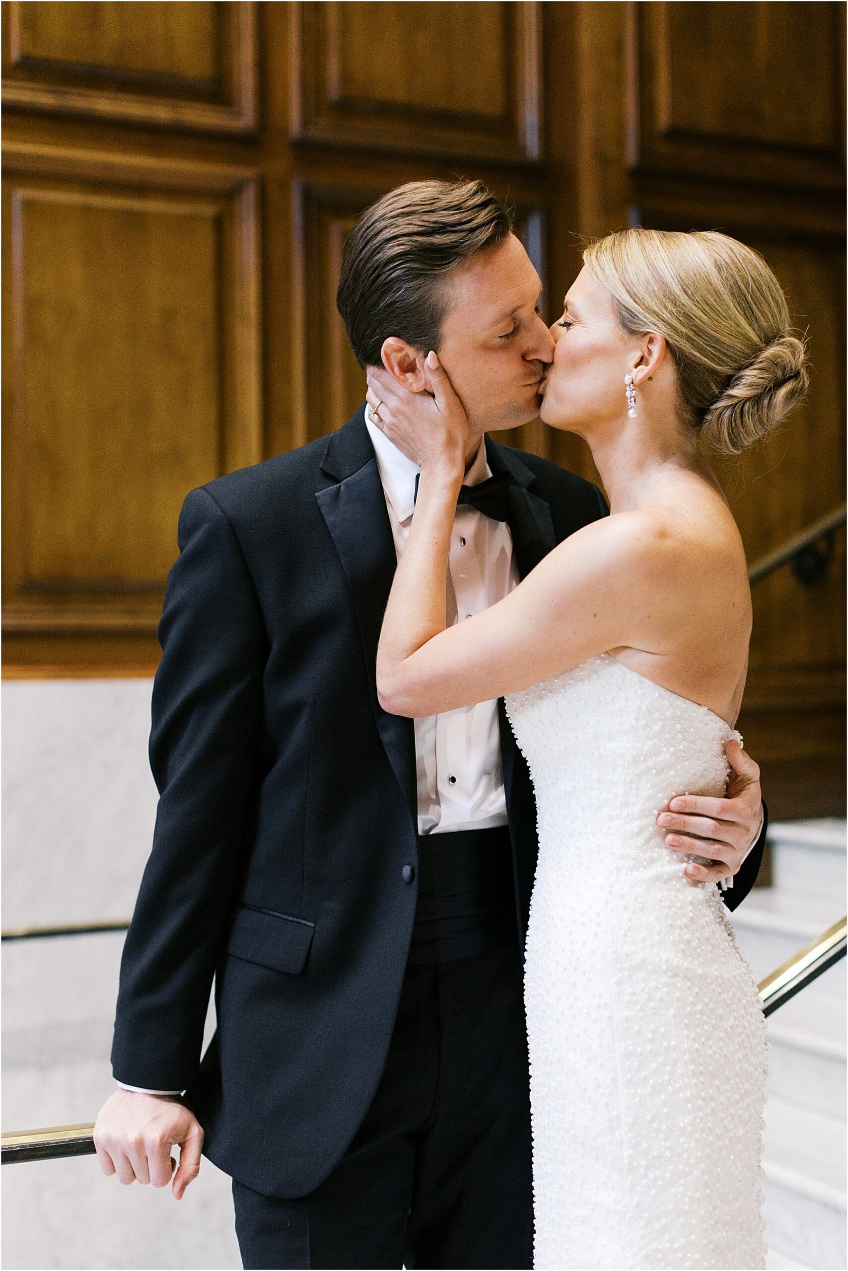 bride and groom at adolphus hotel on marble staircase in dallas texas