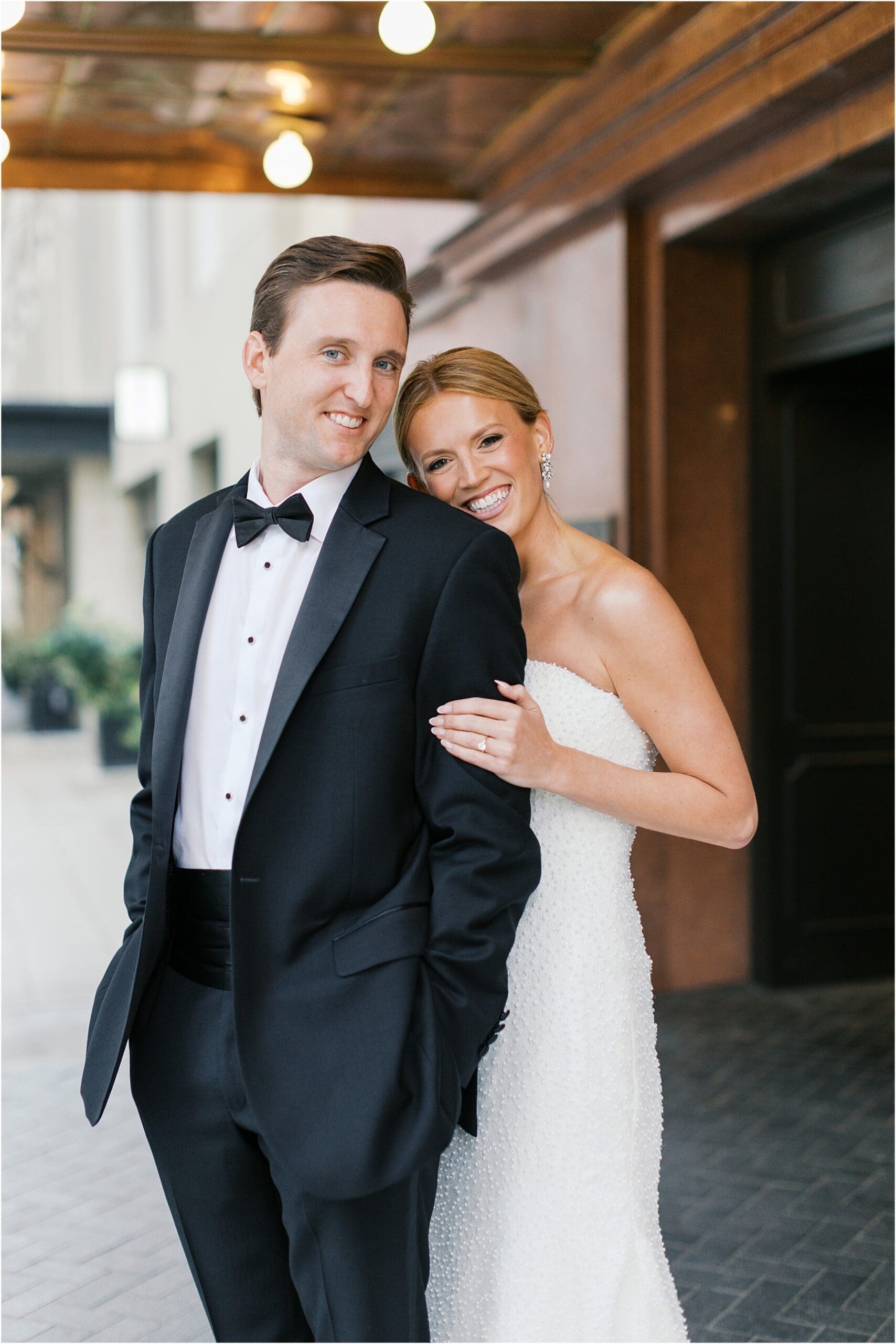 bride and groom in front of adolphus hotel in dallas texas