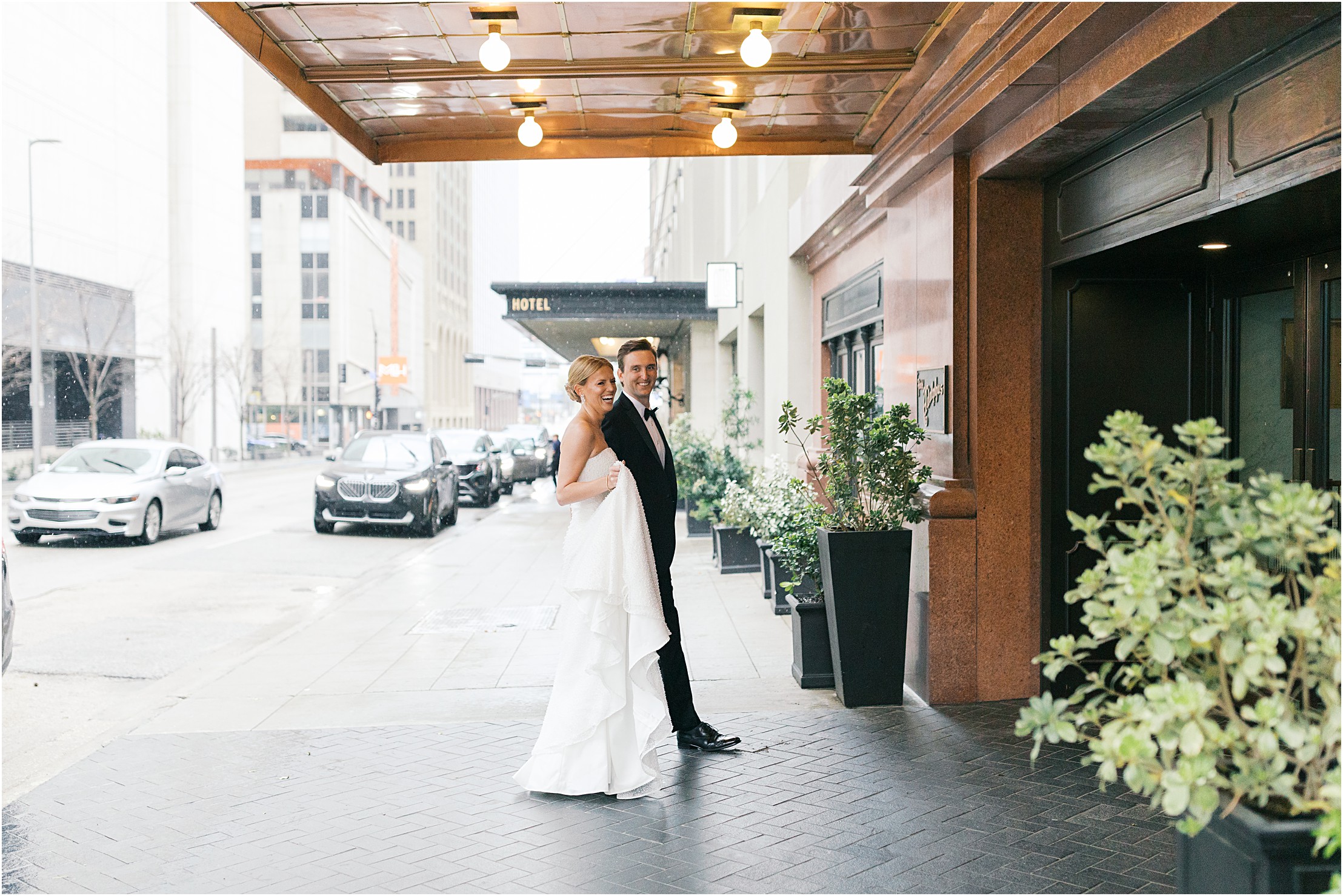 bride and groom in front of adolphus hotel in dallas texas