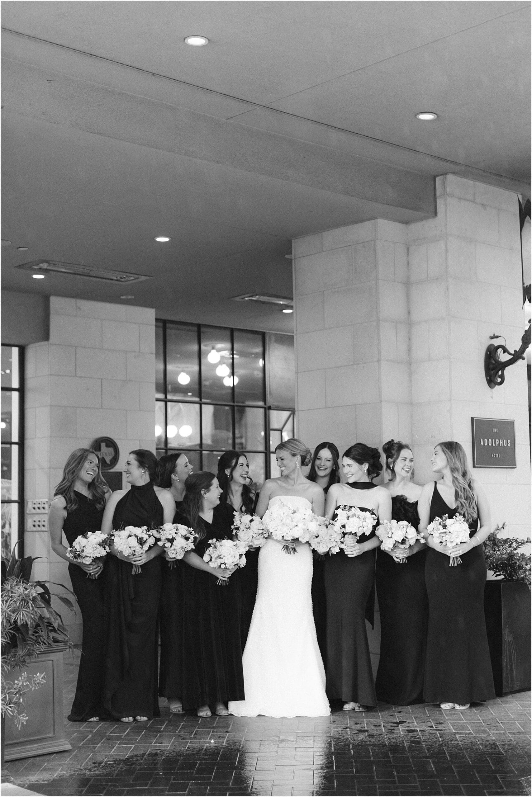 bridesmaids in front of the adolphus hotel in dallas texas