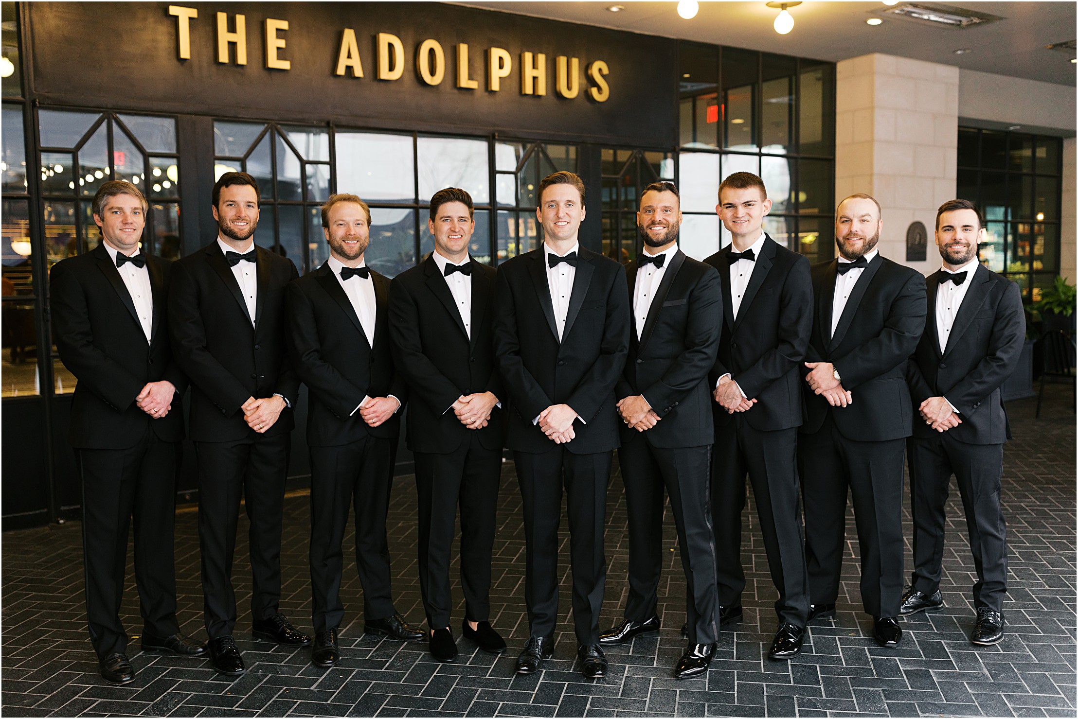 groomsmen in front of the adolphus hotel in dallas texas