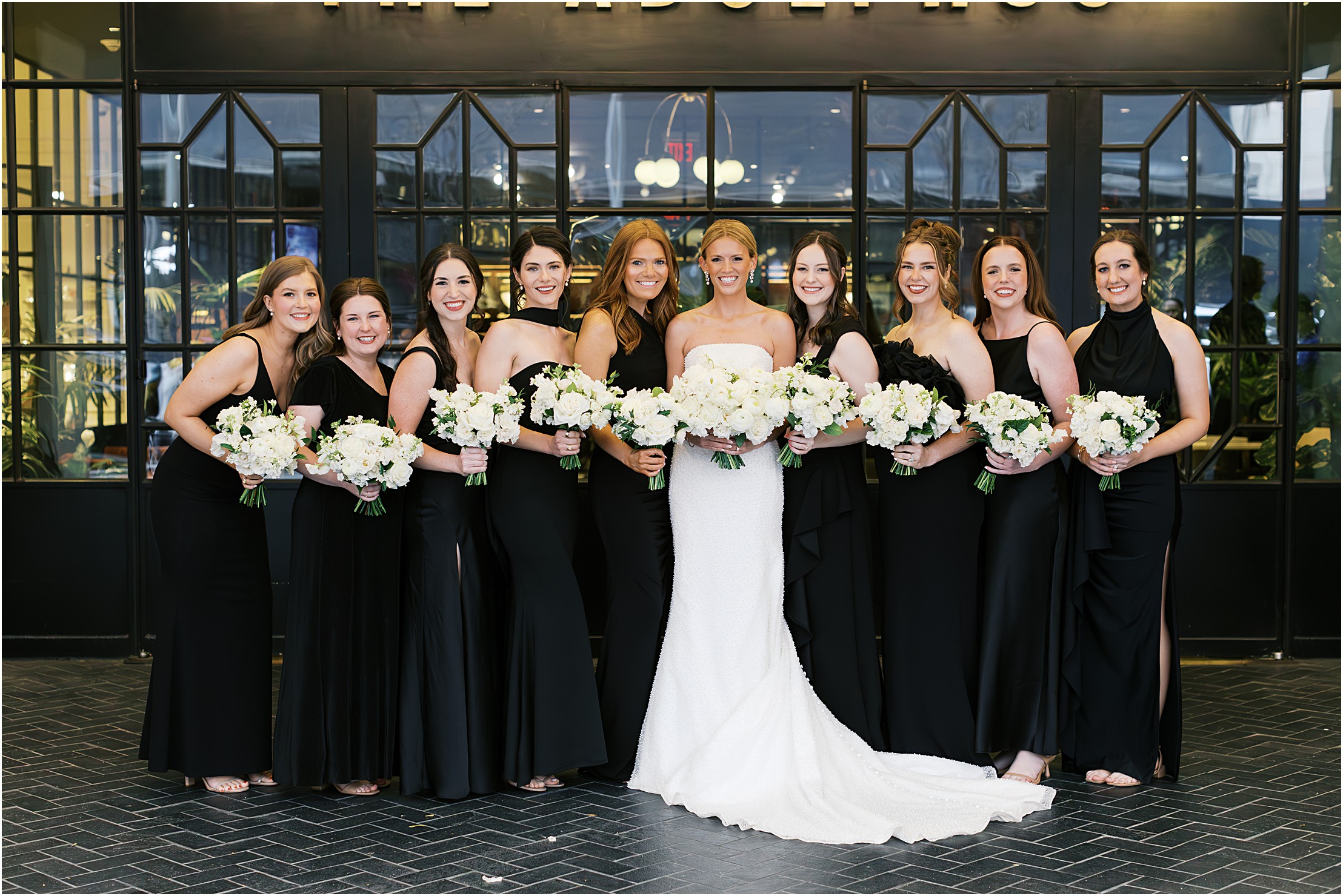 bridesmaids in front of the adolphus hotel in dallas texas