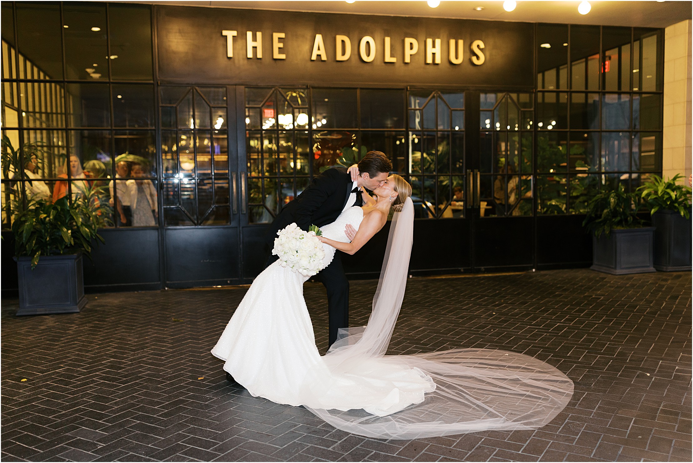 bride and groom in front of adolphus hotel in dallas texas