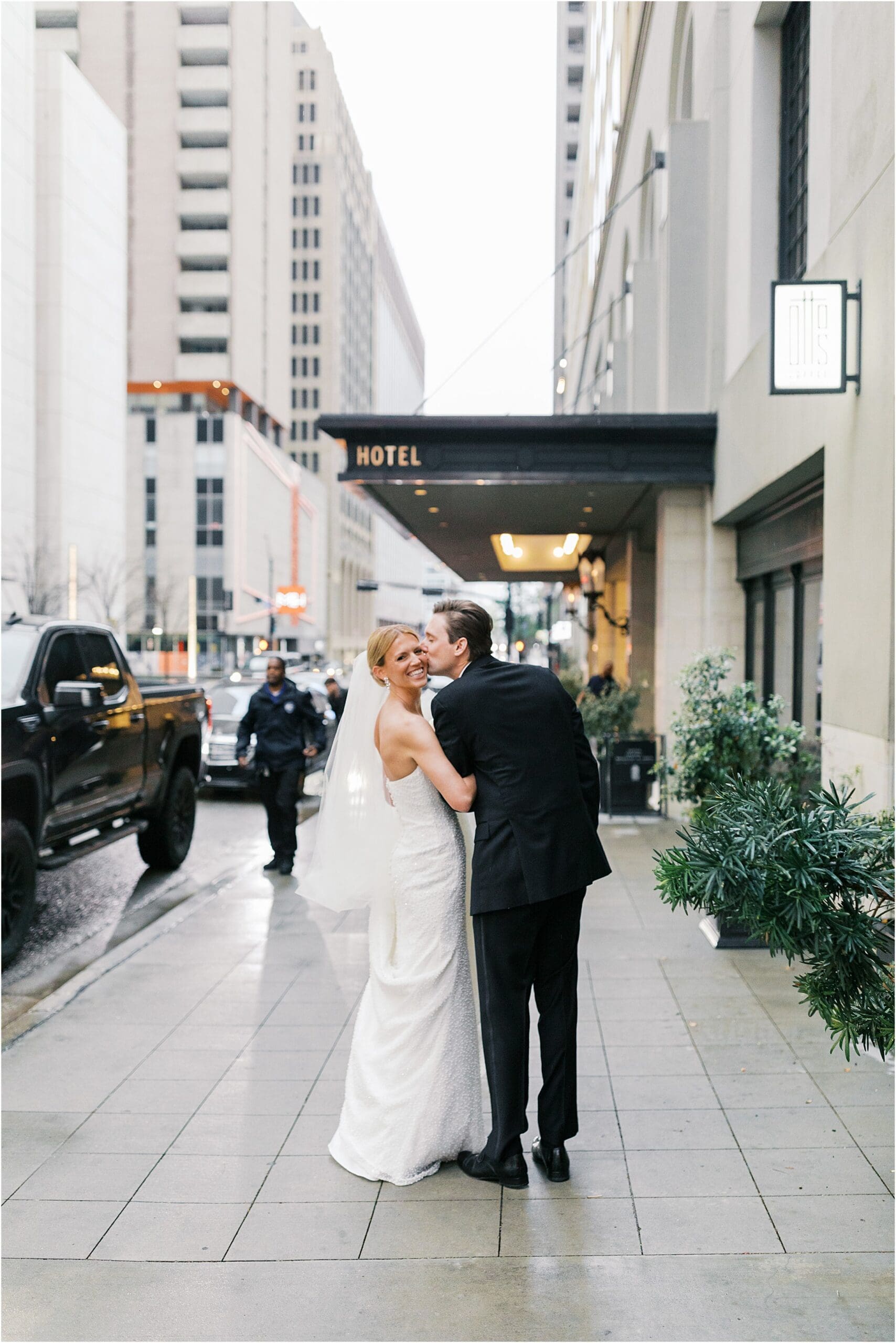 bride and groom in front of adolphus hotel in dallas texas