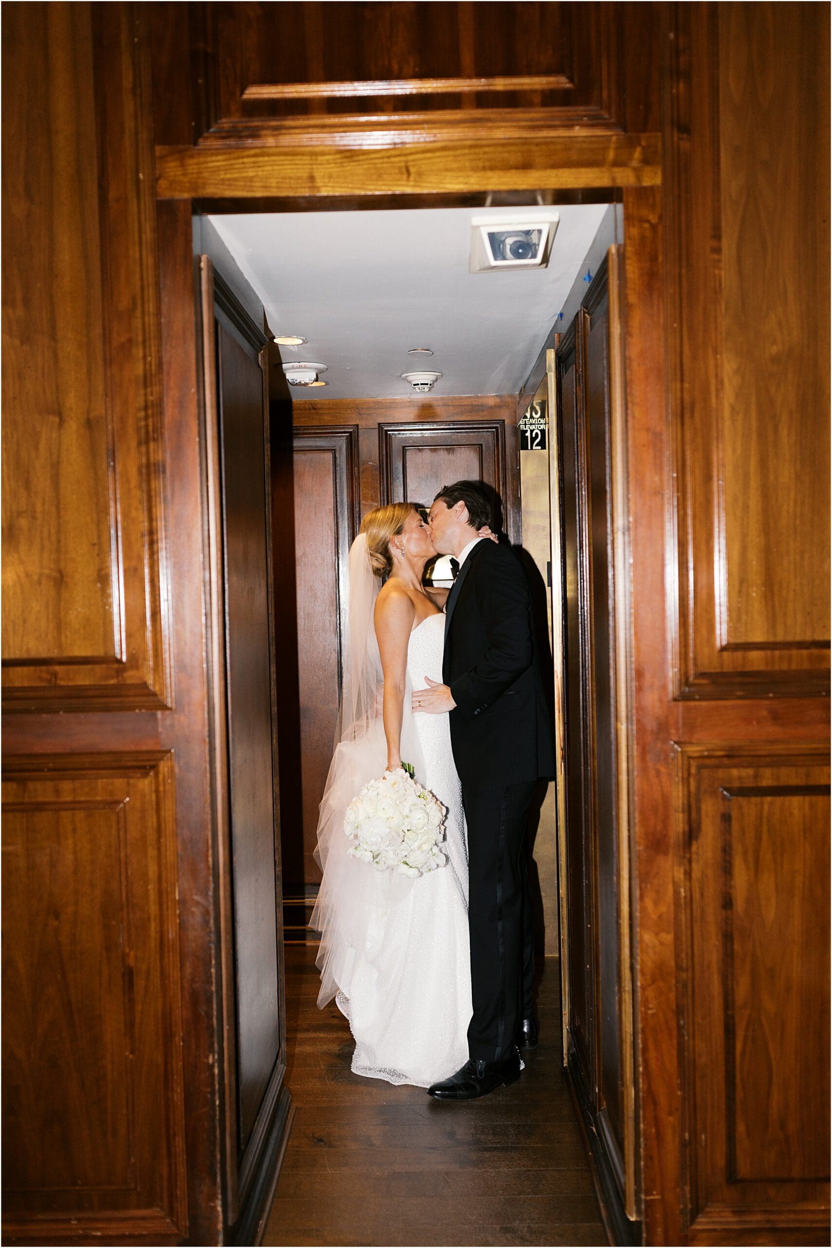 bride and groom in front of adolphus hotel in dallas texas
