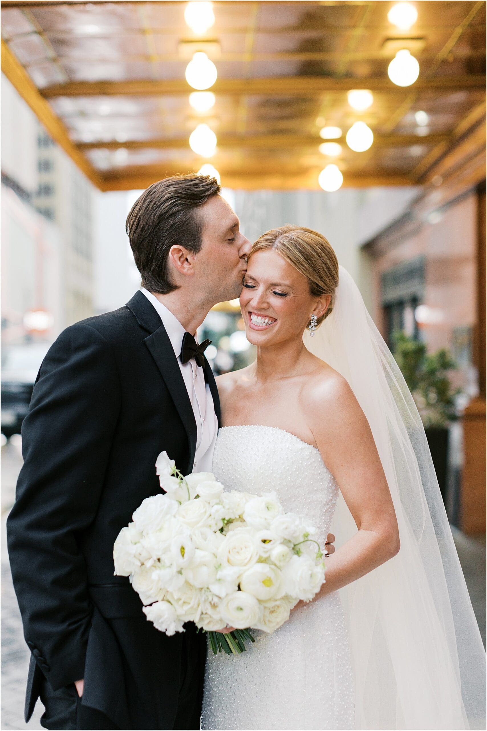 bride and groom in front of adolphus hotel in dallas texas