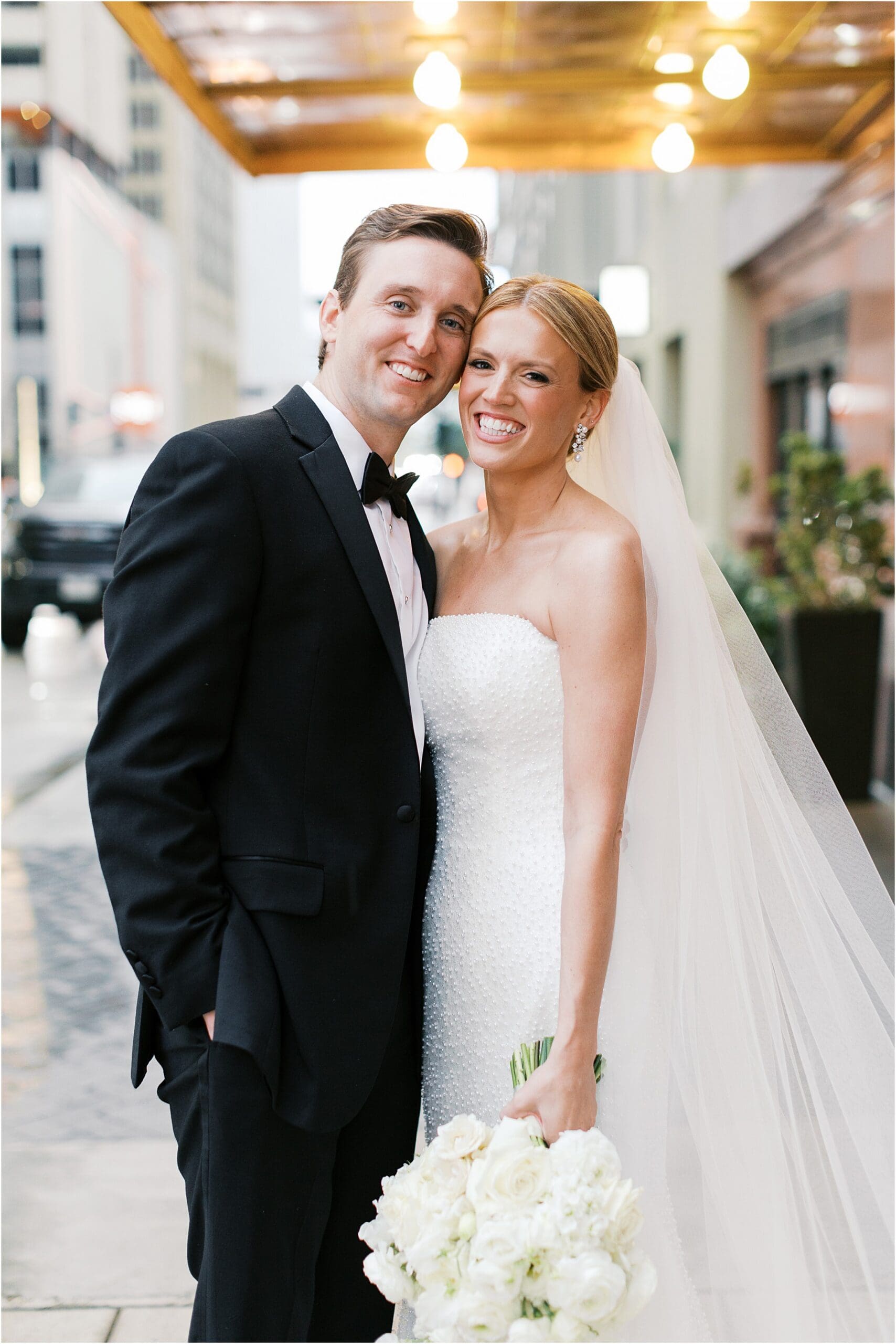 bride and groom in front of adolphus hotel in dallas texas