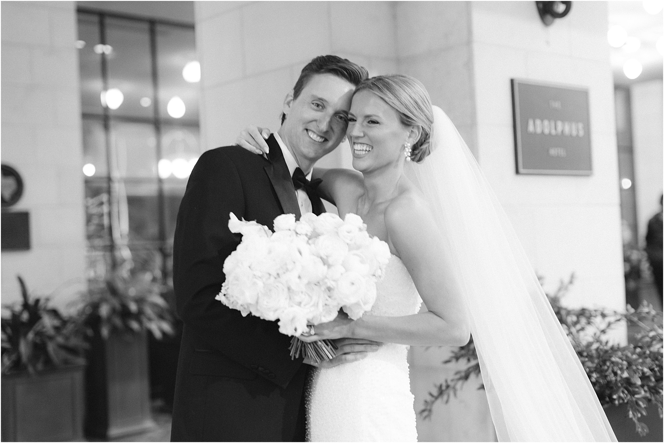 bride and groom in front of adolphus hotel in dallas texas