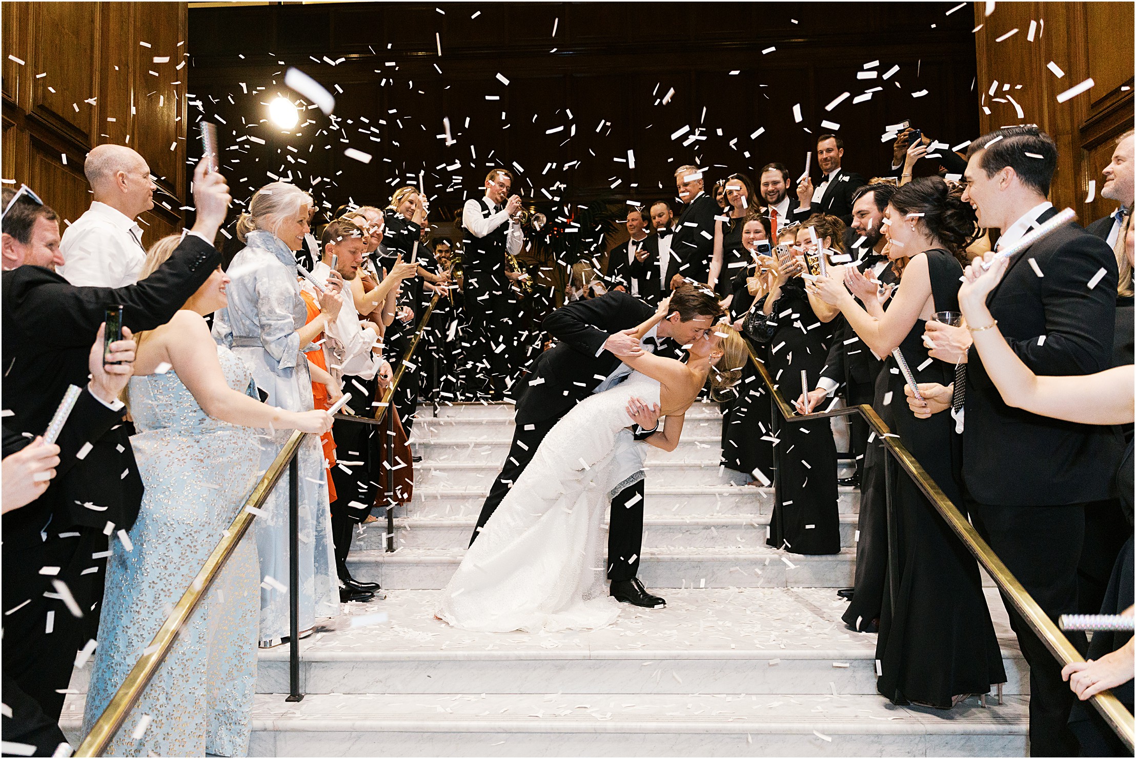 confetti get away in adolphus hotel on marble stairs in dallas texas 