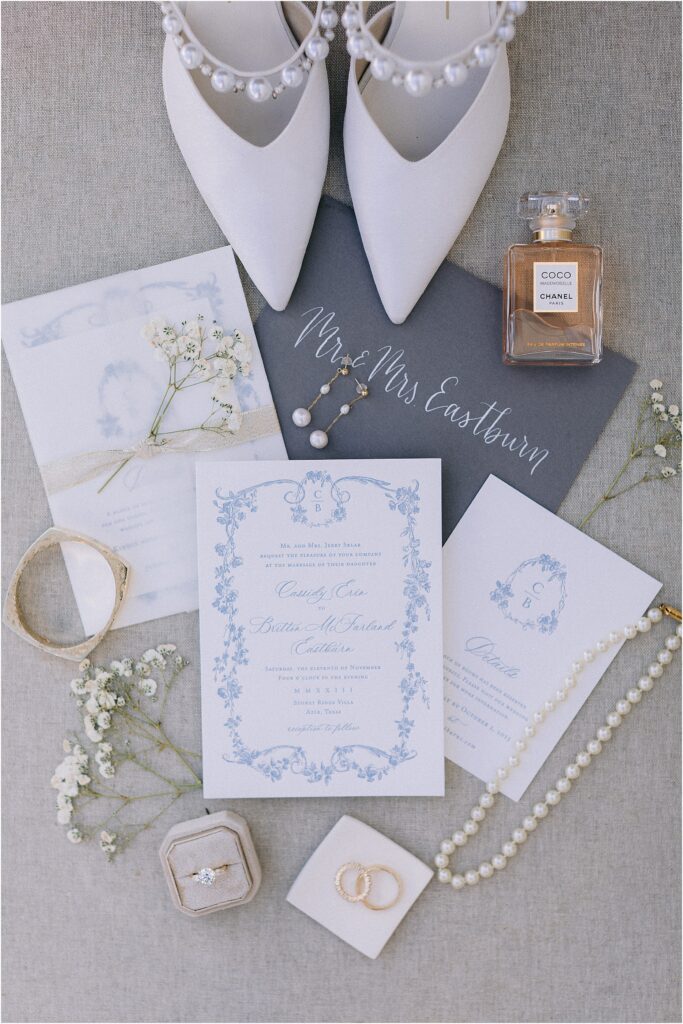 wedding invitation lay flat with blue calligraphy