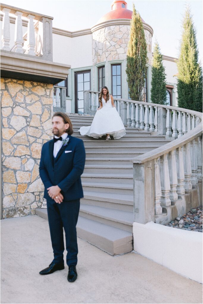 first look with a bride and groom on grand stairs at stoney ridge villa in fort worth Texas