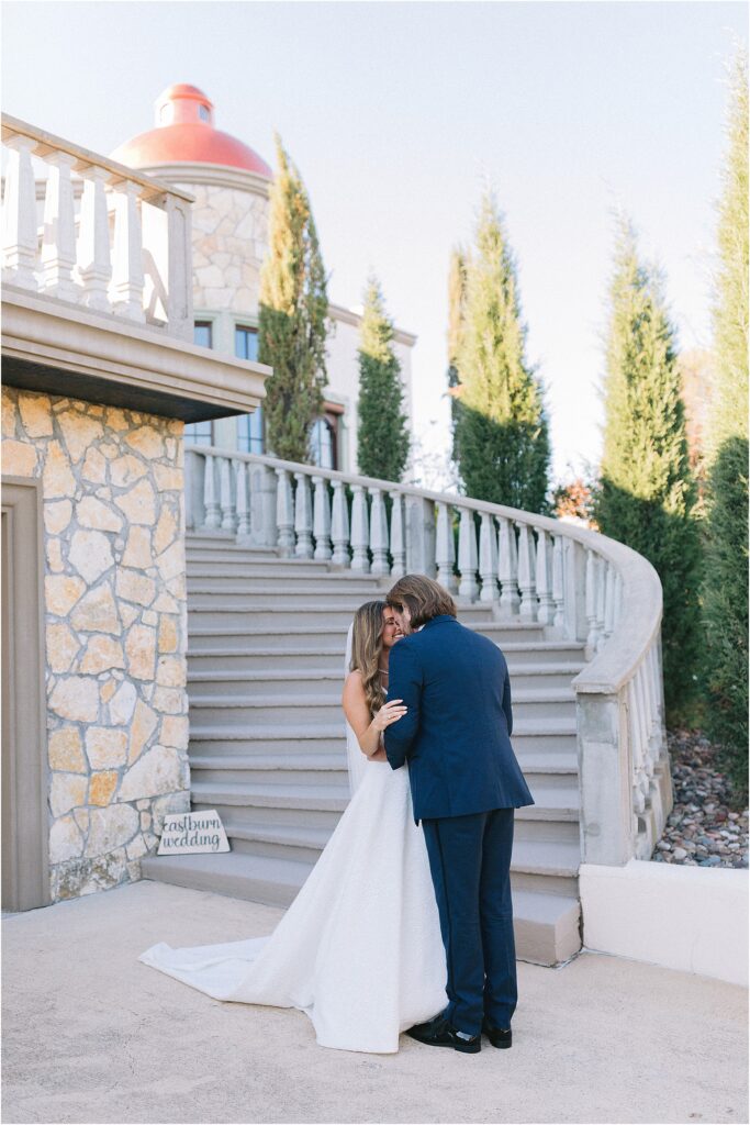 first look with a bride and groom on grand stairs at stoney ridge villa in fort worth Texas