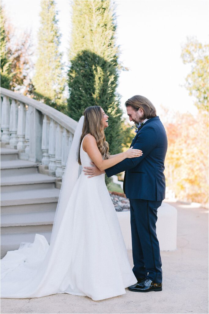 first look with a bride and groom on grand stairs at stoney ridge villa in fort worth Texas