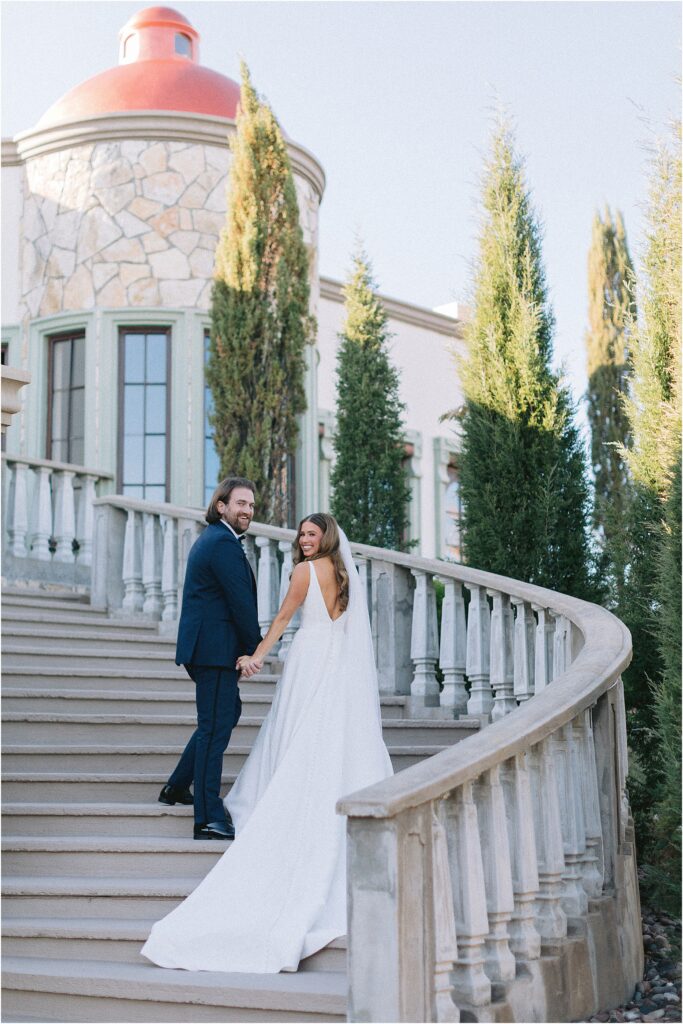 first look with a bride and groom on grand stairs at stoney ridge villa in fort worth Texas