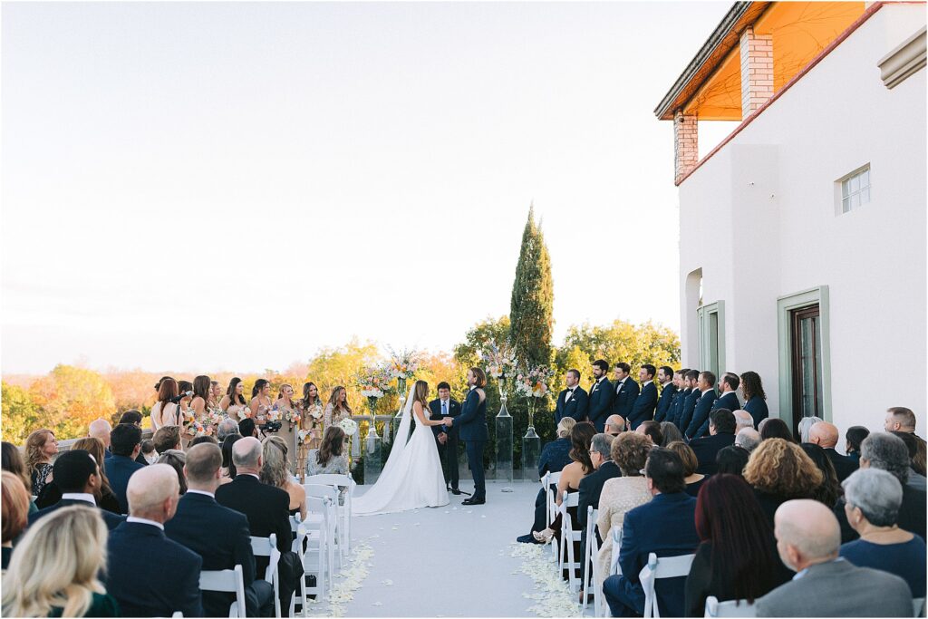 wedding ceremony on the terrace at stoney ridge villa in fort worth texas